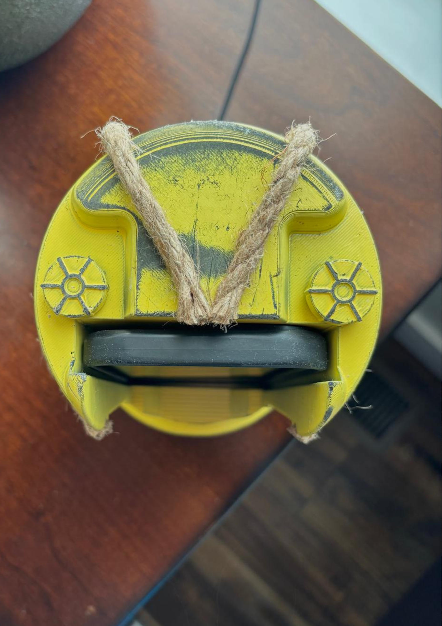 JAWS inspired yellow barrel smartphone charging dock
